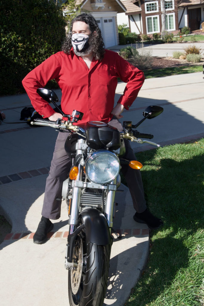 be3n sits on Ducati motorcycle